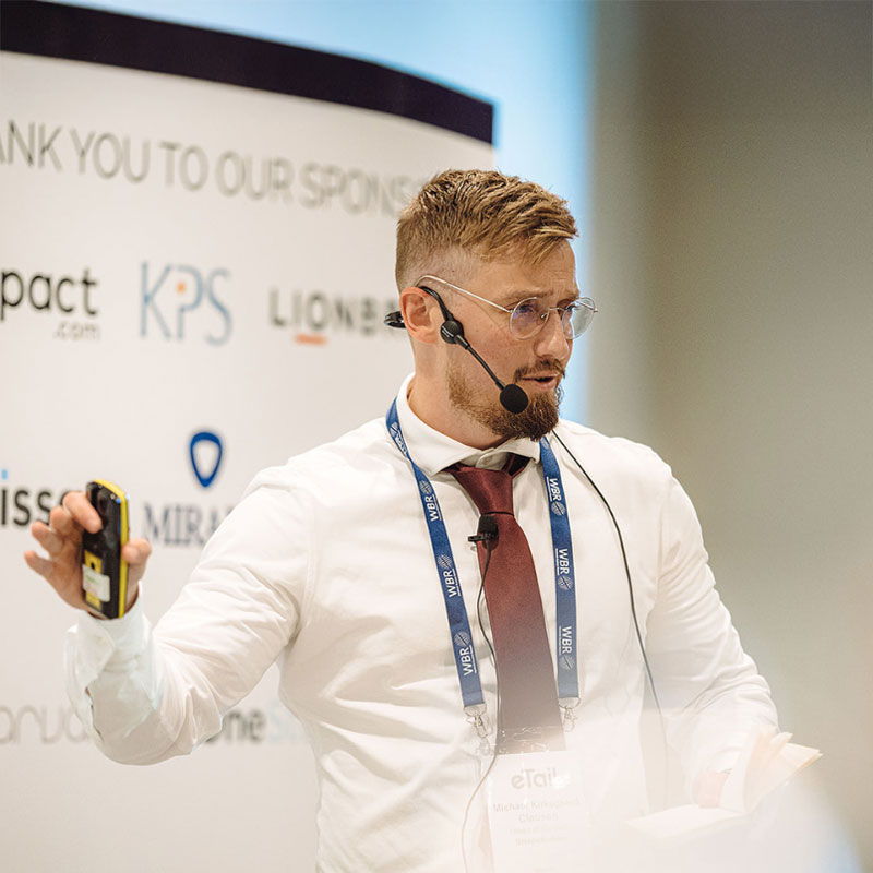 Michael Kirkegaard speaking on stage